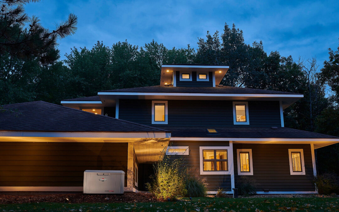 A Home with a Backup Generator at Dusk has Lights