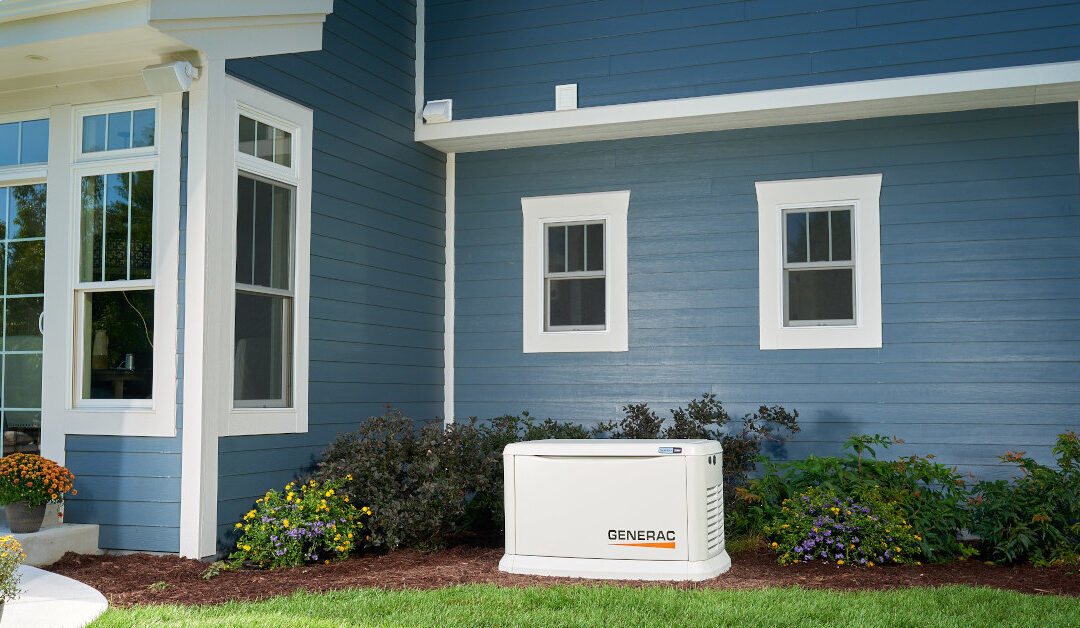 Generac 22kW Natural Gas Generator Installed in a Backyard Next to a Blue Two Story House