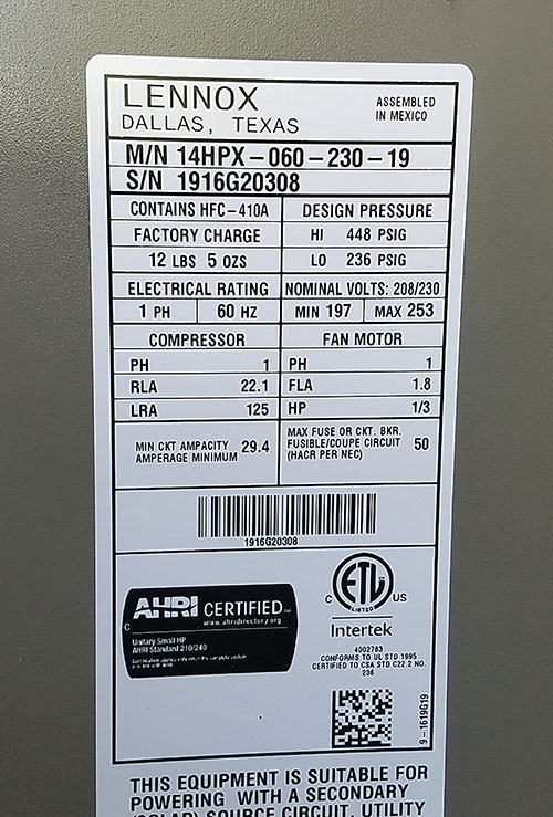 A Central Air Conditioner Nameplate Showing Power Requirements for two motors, and total appliance power requirements.