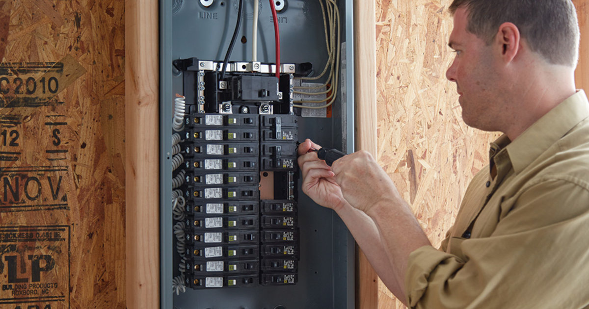 An Electrician Readies a 200-Amp Main Circuit Breaker Panel for Wiring